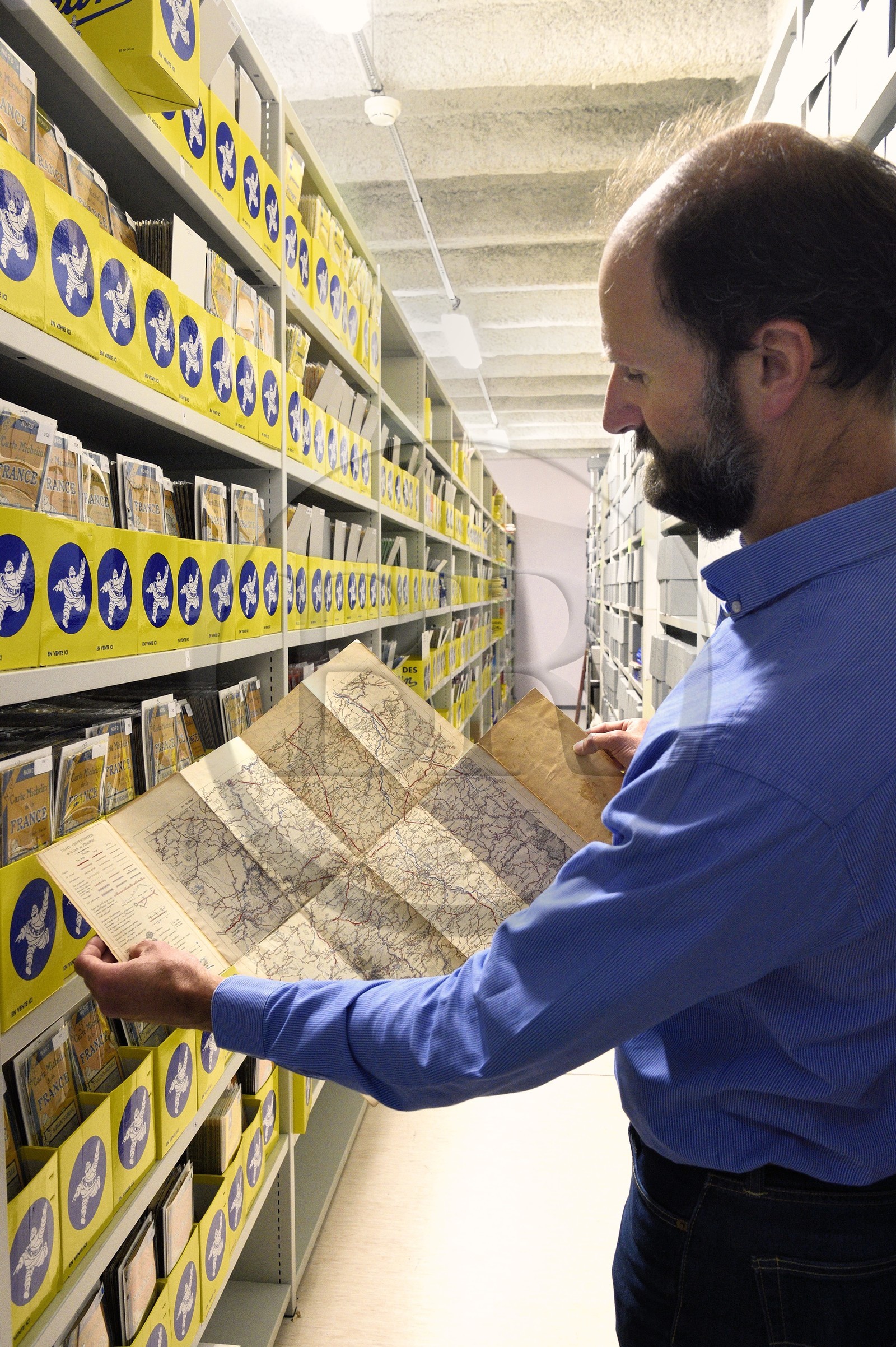 France, Puy de Dome, Clermont Ferrand, L'Aventure Michelin archives, museum retracing all the activities of the Michelin group, Stéphane Nicolas, responsible for historical heritage at Michelin, presents the very first 1908 test map of the Clermont-Ferrand region