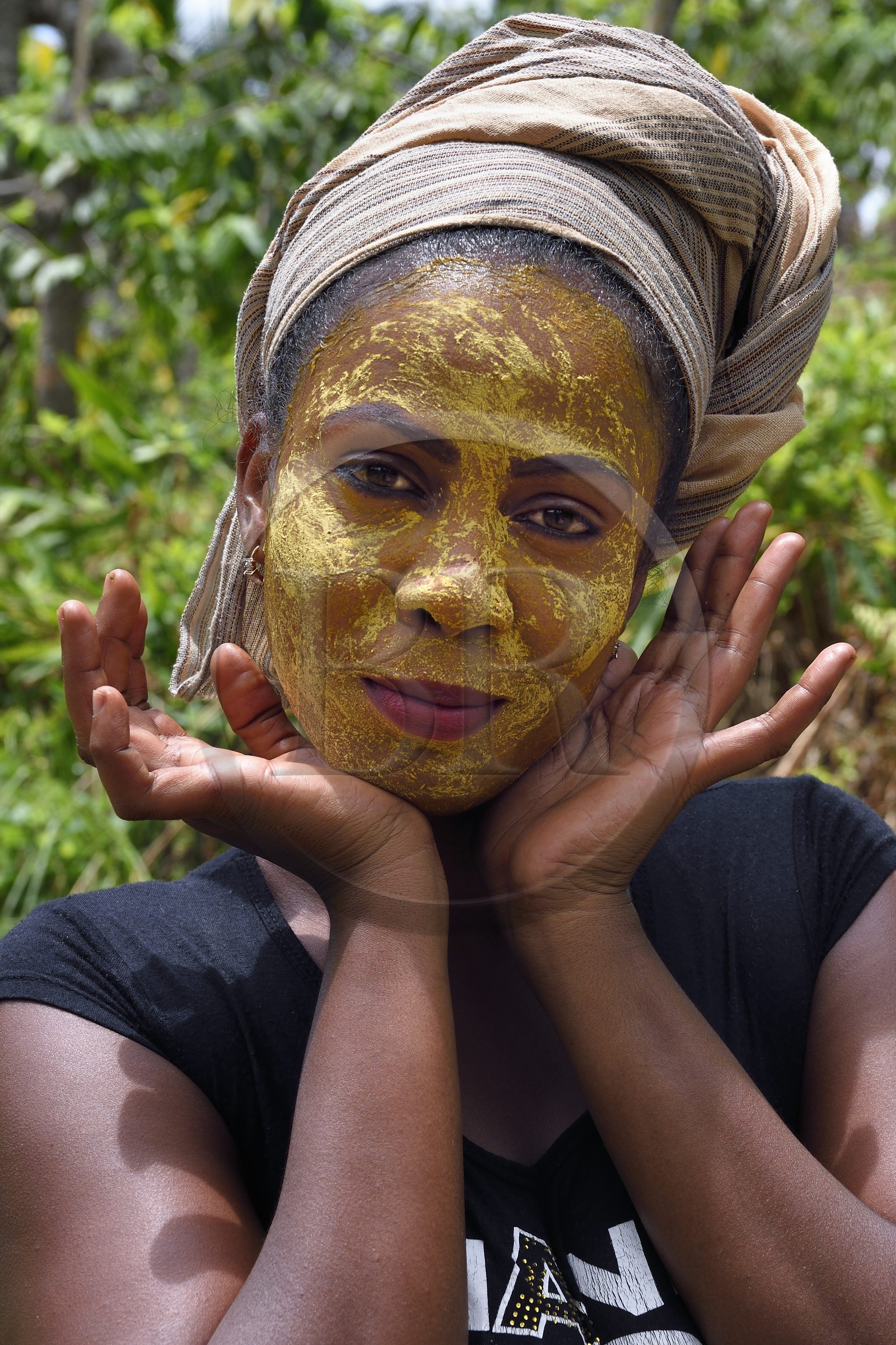 France, Mayotte island (French overseas department), Grande-Terre, Ouangani, Mahorais woman wearing a facial mask with sandalwood (the m'sindzano)