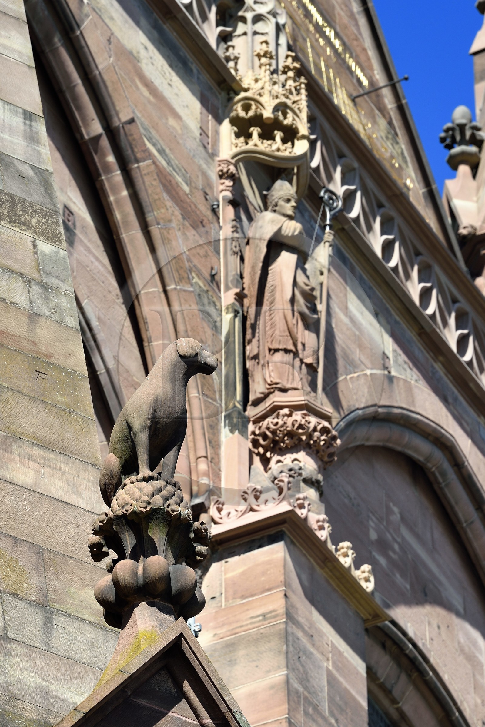 France, Bas Rhin, Strasbourg, old town listed as World Heritage by UNESCO, Notre Dame Cathedral, southern facade, dog (a pointer) and statue of Saint Arbogaste, one of the patrons of Alsace