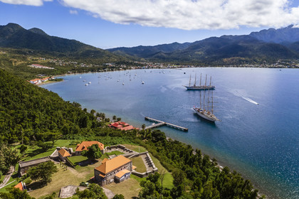 Caribbean, Dominica Island, Portsmouth, Cabrits National Park, Fort Shirley, 18th century British fort, the Royal Clipper and the Star Flyer of the Star Clipper company in Prince Rupert Bay (aerial view)