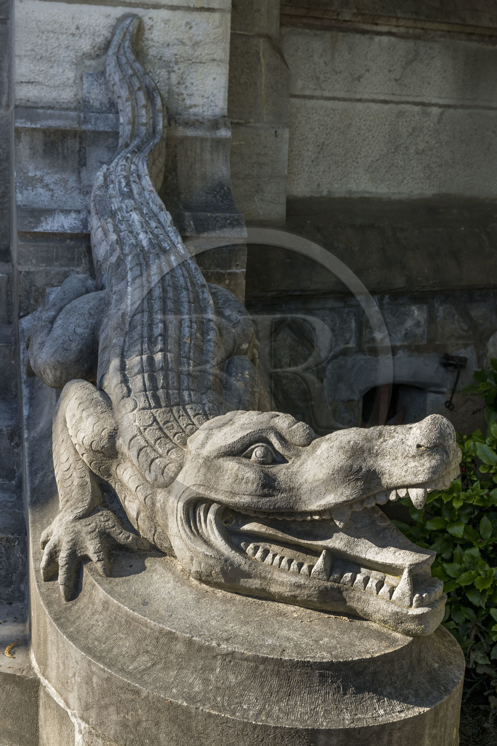 France, Pyrenees Atlantiques, Basque Country coast, Hendaye, Abbadia castle built in 1870 by Eugène Viollet-le-Duc for Antoine d'Abbadie d'Arrast, one of the two crocodiles guarding the main entrance