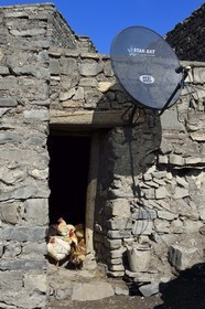 Azerbaijan, Quba (Guba) region, Greater Caucasus mountain range, village of Khinalug (Xinaliq), henhouse and satellite dish