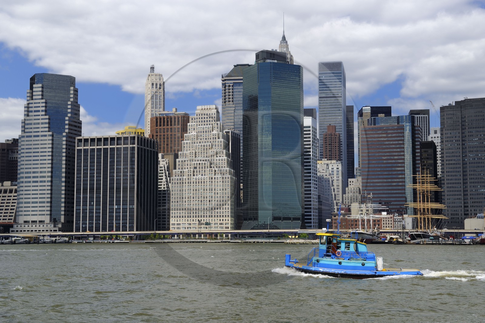 United States, New York City, Downtown Manhattan, East River in front of South Street Seaport seen from the Promenade in Brooklyn
