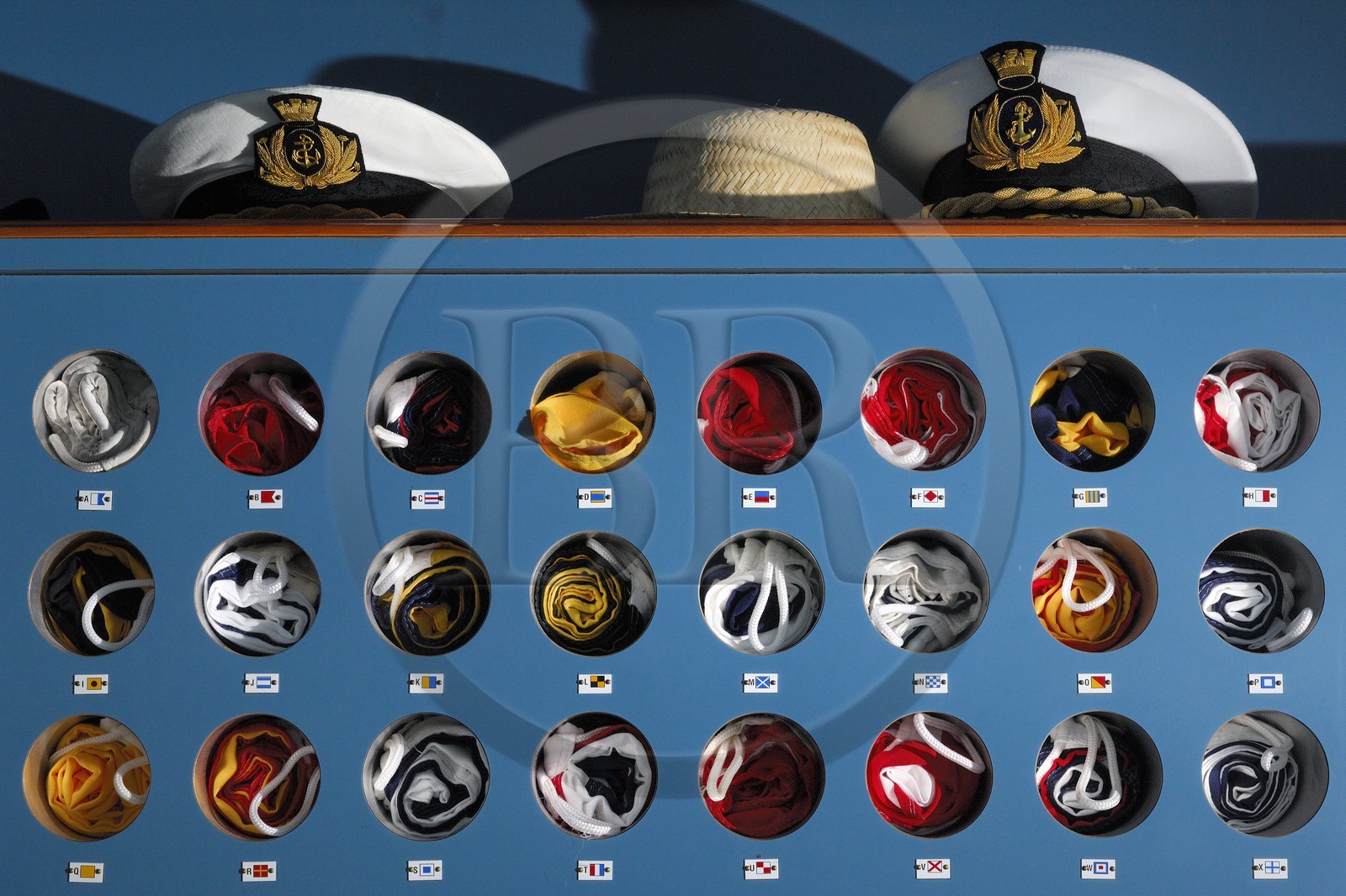Italy, cruise aboard the Silvershadow ship of the company Silversea, flags locker and caps of officers
