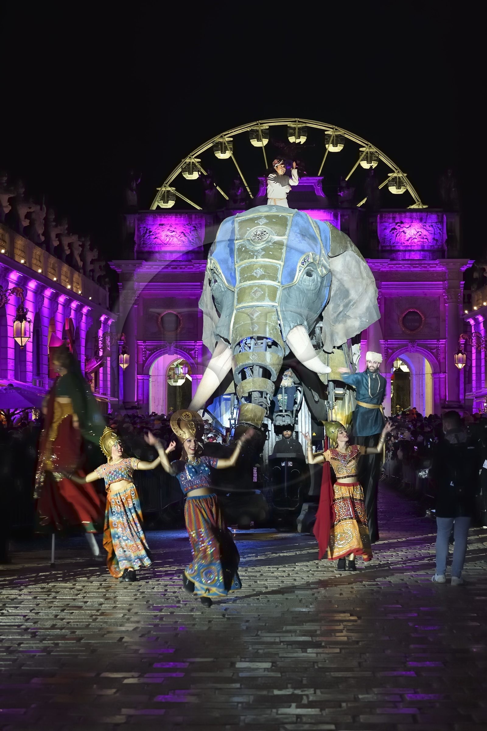 France, Meurthe-et-Moselle, Nancy, place Stanislas, the parade of Saint-Nicolas, Elephantasia and its dancers from the company Planète Vapeur in front of the Arc de Triomphe (Porte Héré)