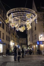 France, Bas Rhin, Strasbourg, old town listed as World Heritage by UNESCO, Christmas light hung at the corner of Grand Rue and rue du Fossé des Tanneurs