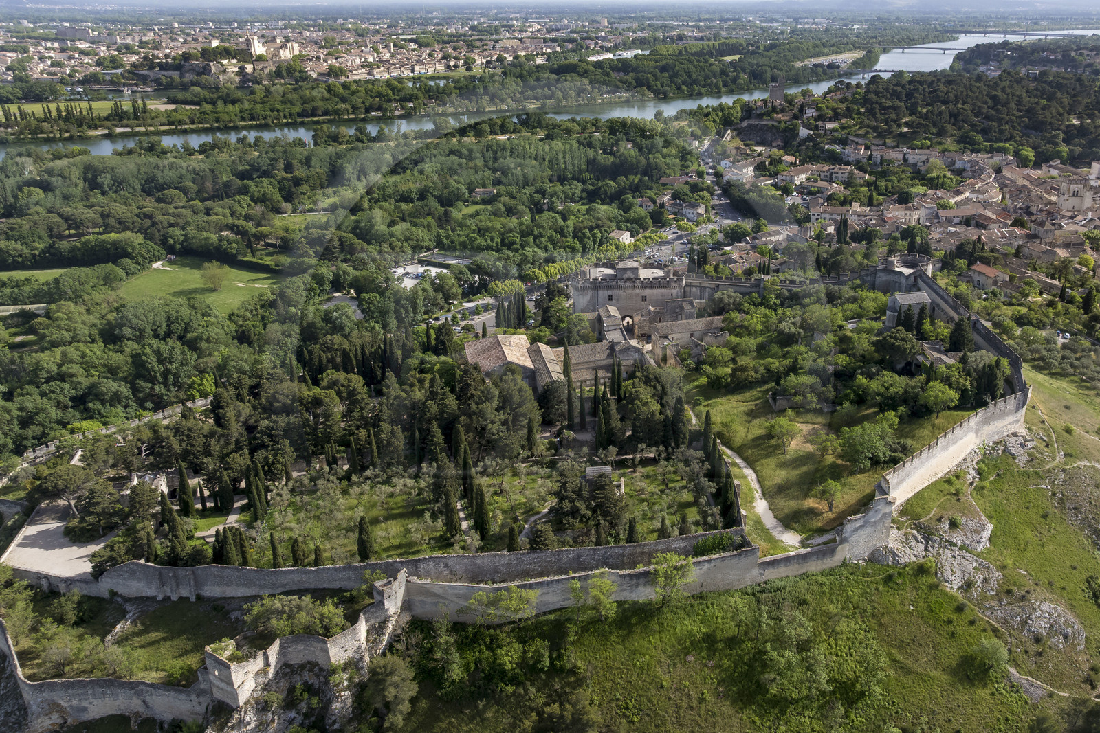 France, Gard, Villeneuve les Avignon, the former Benedictine abbey in the Saint Andre Fort, the Palais des Papes (Palace of the Popes) in Avignon classified as UNESCO World Heritage in the background (aerial view)