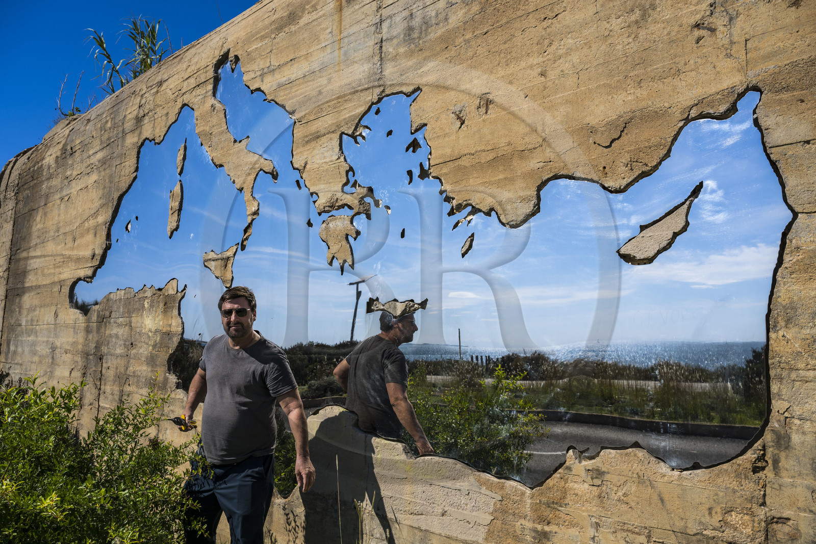 France, Herault, Sete, visual artist Jean Denant in front of his work La Traversée (subsequently transposed into Mare Nostrum) embedded in the bunker on the Corniche promenade