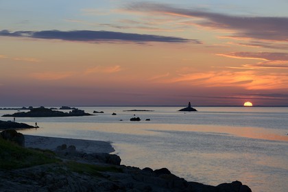 France, Finistere, La Foret Fouesnant, Glenan islands, St Nicolas Island, sunset on the west coast and the former Huic lighthouse now abandoned