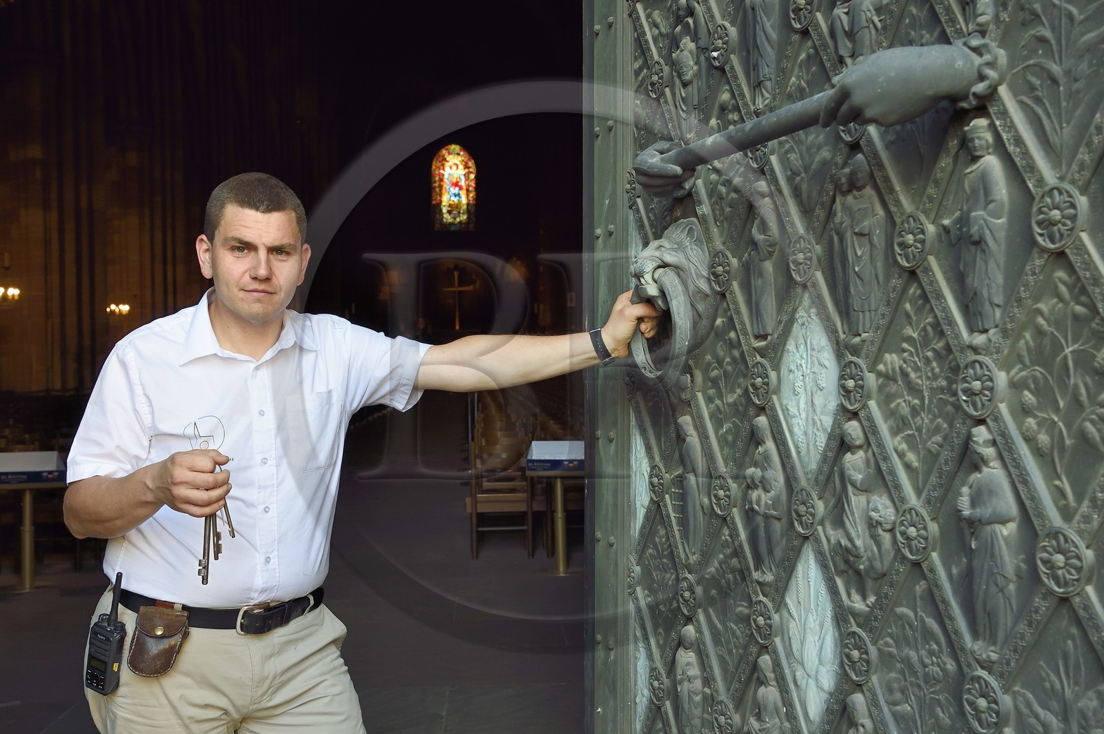 France, Bas Rhin, Strasbourg, old town listed as World Heritage by UNESCO, Notre Dame Cathedral, Sacristan Michel Bolli opens the main door of the Western facade in the early morning