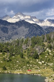 France, Hautes Pyrenees, Saint Lary Soulan and Vielle-Aure, hike on a variant of the GR10 between the Portet pass and the Bastan lakes on the edge of the Neouvielle nature reserve, lower Bastan lake and the Neouvielle massif in the background