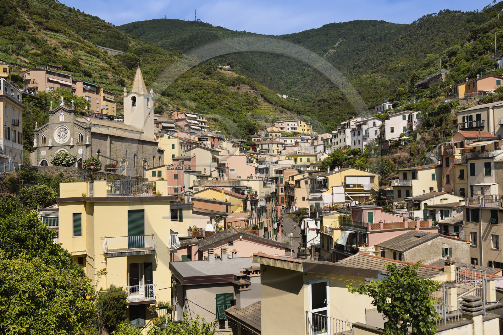 Italy, Liguria, Cinque Terre National Park listed as World Heritage by UNESCO, village of Riomaggiore and the parish church of San Giovanni Battista (Saint John the Baptist)