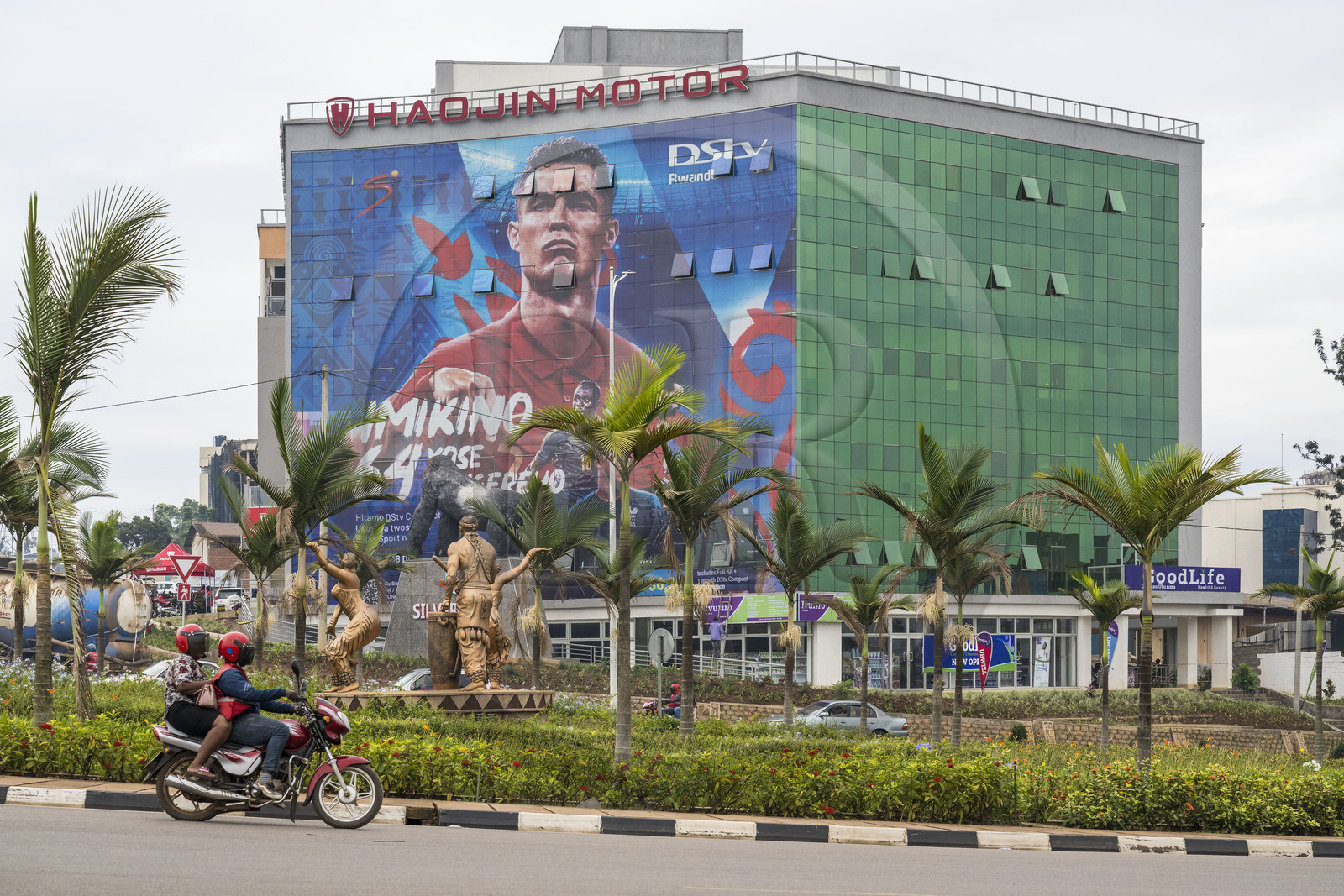 Rwanda, Kigali, the Silverback mall with a giant advertisement for the soccer world cup and a sculpture of traditional Intore dancers