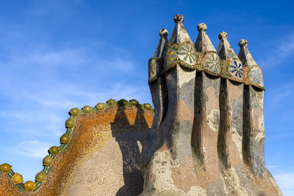 Spain, Catalonia, Barcelona, Eixample district, Passeig de Gracia, Casa Batllo by Catalan modernist architect Antoni Gaudi, UNESCO World Heritage site, chimneys and roof suggesting the dragon's spine