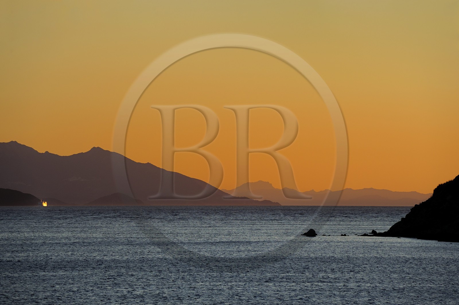 Italy, Tuscany, the Island of Elba at sunset and the coast at Piombino in the foreground