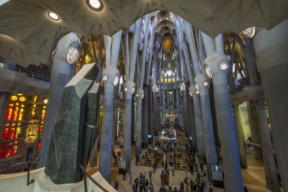 Spain, Catalonia, Barcelona, Eixample district, Sagrada Familia basilica by Catalan modernist architect Antoni Gaudi, listed as a UNESCO World Heritage Site, view of the nave from the facade of the Glory, in the foreground the bronze statue of Saint George by the sculptor Subirachs