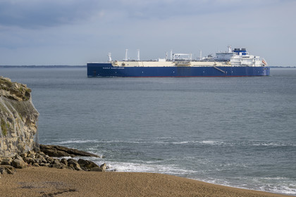 France, Loire Atlantique, Estuaire de la Loire, Saint Nazaire, Courance beach in Saint-Marc-sur-Mer, LNG tanker entering the Loire estuary in the background