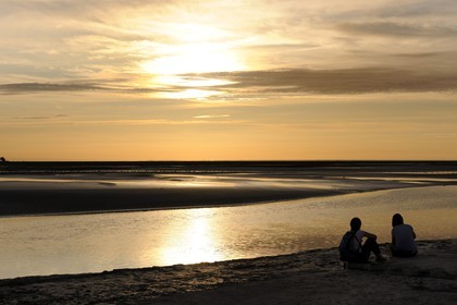 France, Manche, Bay of Mont Saint Michel, intertidal zone of Couesnon River at sunset