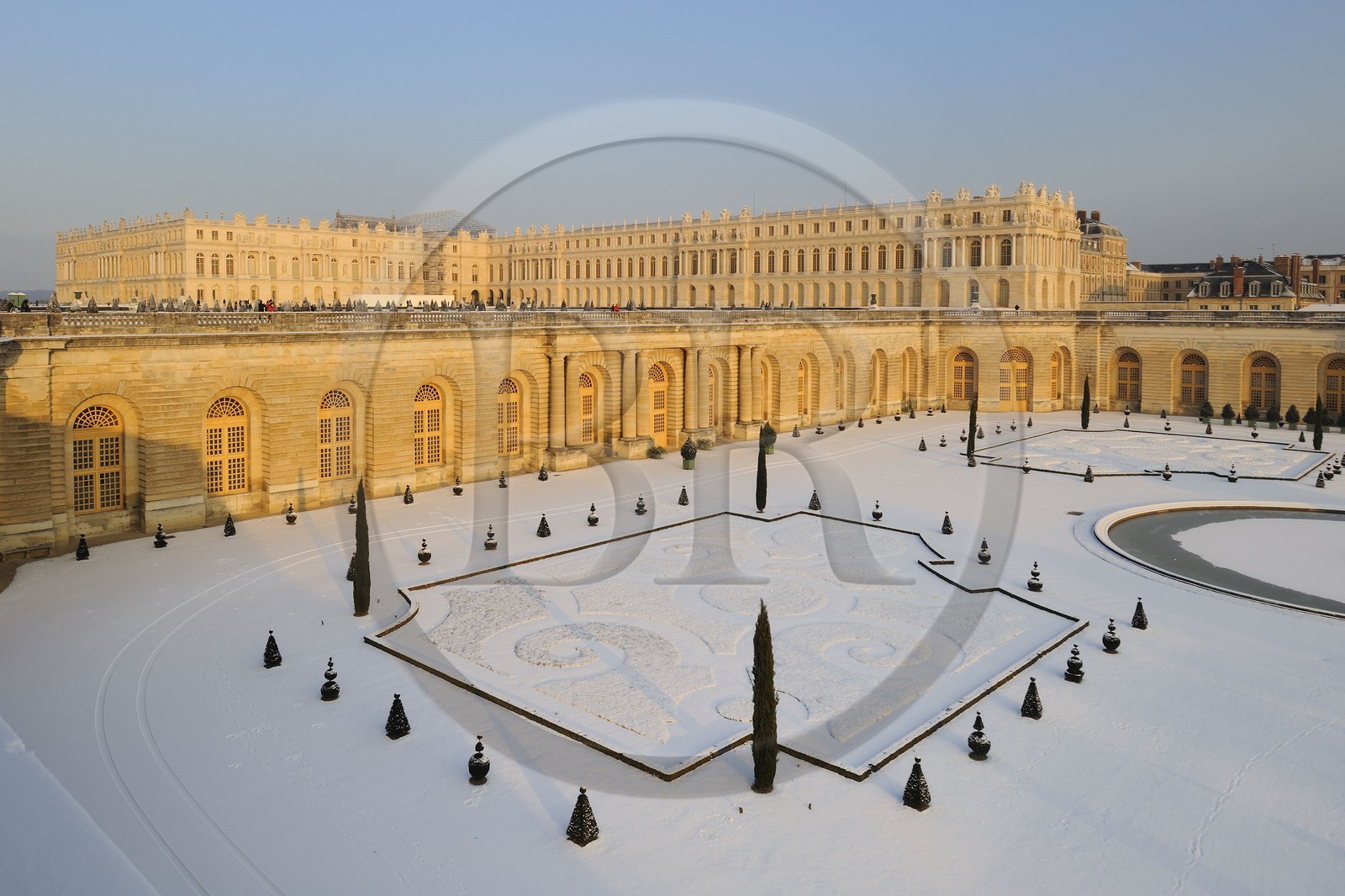 France, Yvelines, snow covered park of the Chateau de Versailles, listed as World Heritage by UNESCO, Orangery and its parterre