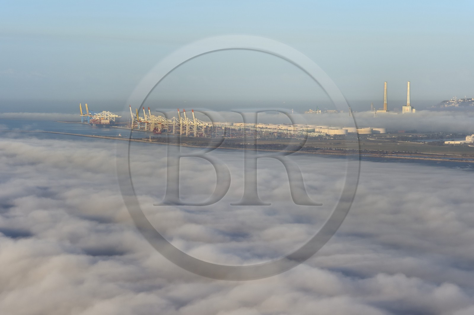France, Seine Maritime, Le Havre, the port of Le Havre emerges from a sea of clouds