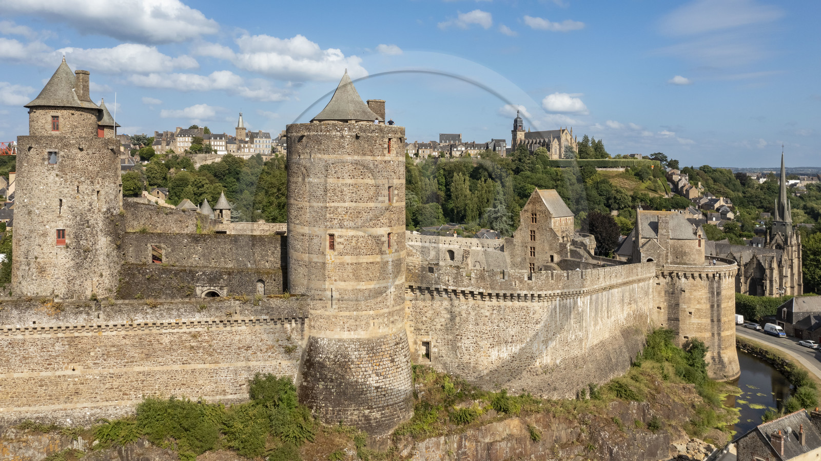 France, Ille-et-Vilaine, Fougeres, 12th century fortified castle and the Saint-Sulpice church, the Saint-Léonard church in the background (aerial view)