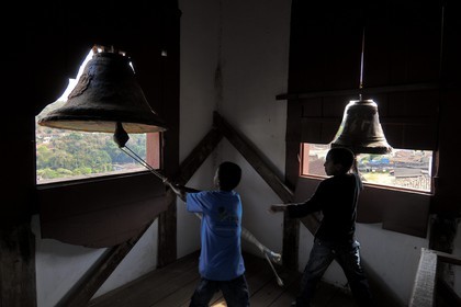 Brazil, Minas Gerais state, Serro, Nossa Senhora do Carmo church, children altar server ringing the bells for Mass (Gold Route, Estrada Real)