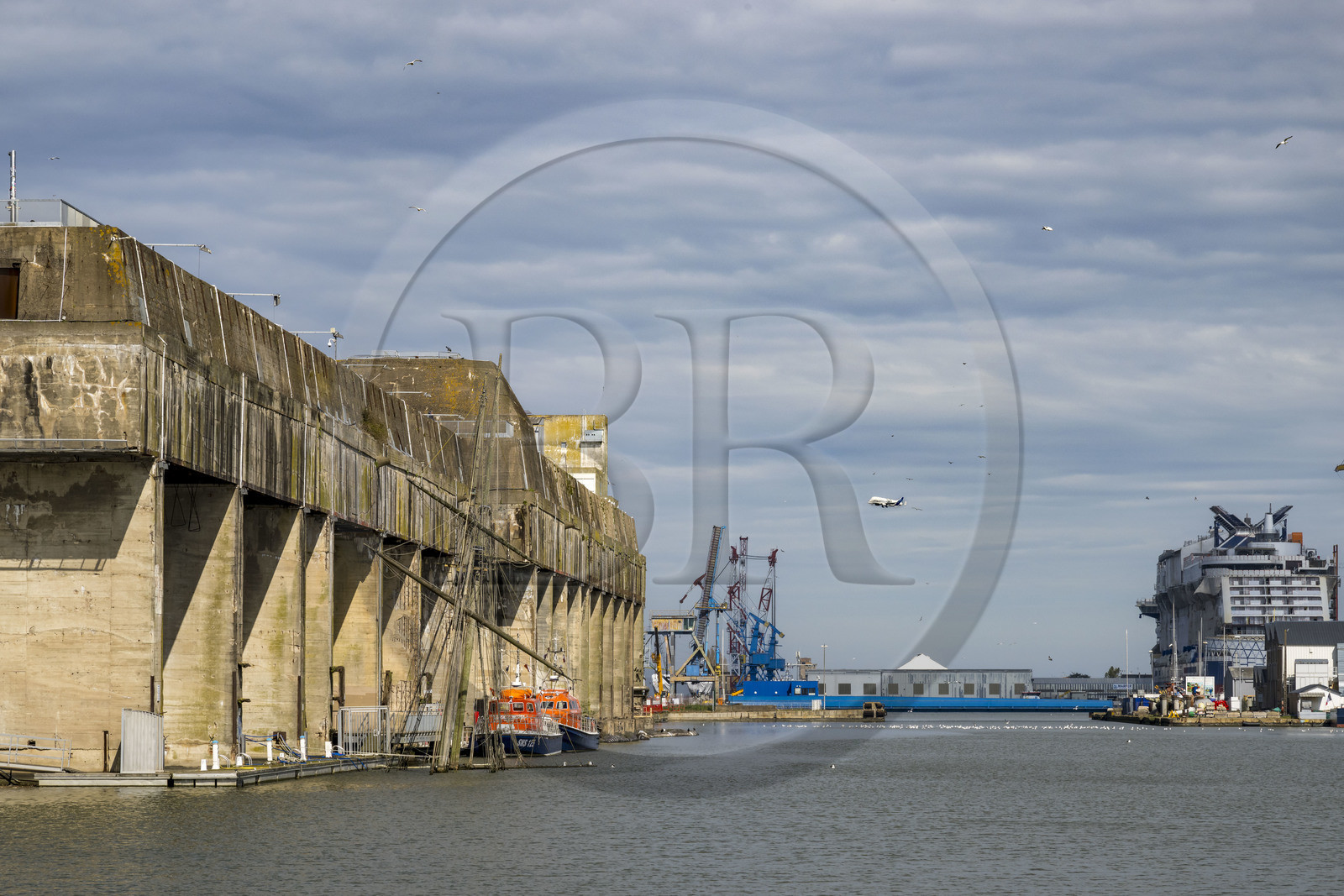 France, Loire Atlantique, Saint Nazaire, the former German submarine base built during the last world war border the dock of the harbour basin of Saint-Nazaire