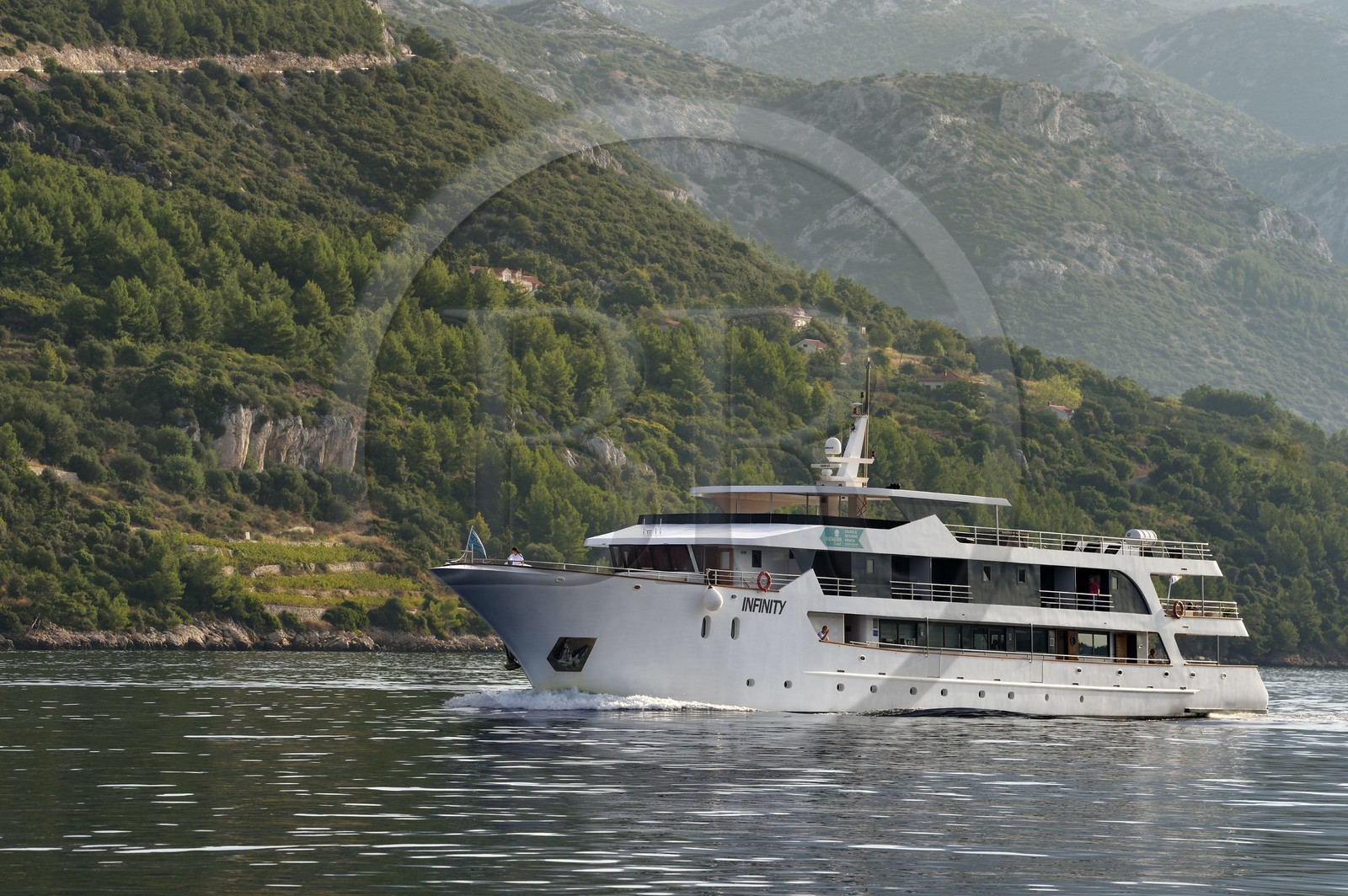 Croatia, Dalmatia, Dalmatian coast, cruise ship progressing in the strait between the peninsula of Peljesac (in the background) and the island of Korcula