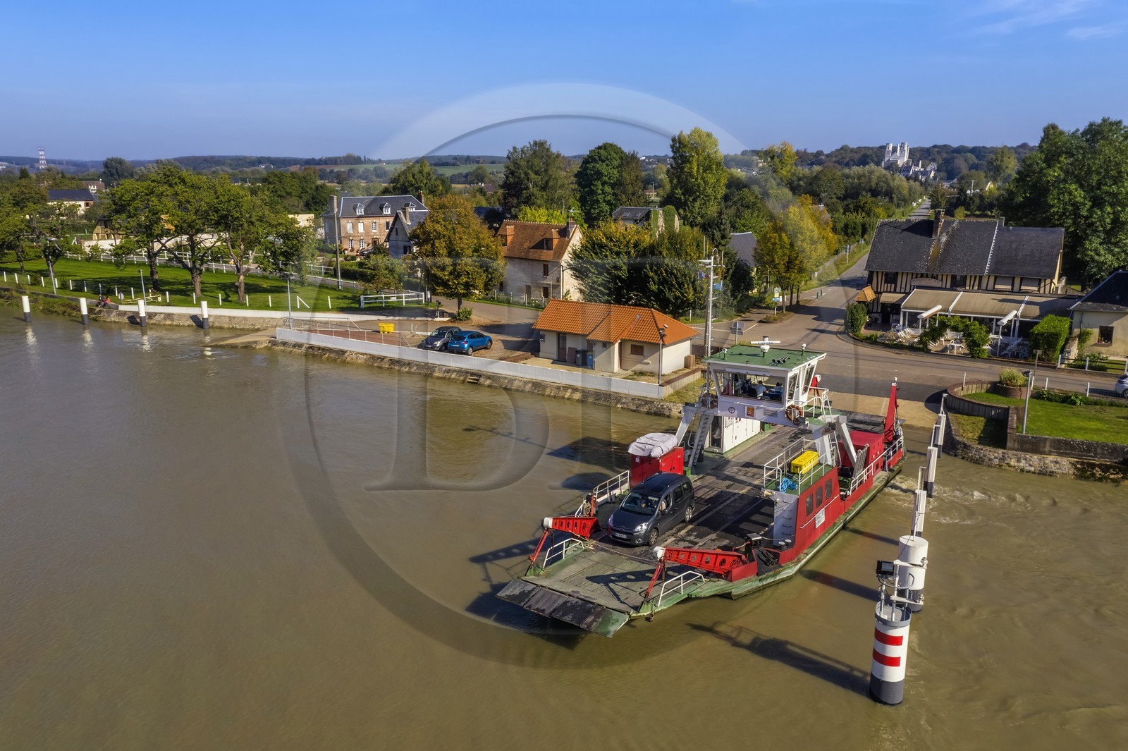France, Seine-Maritime, Pays de Caux, Norman Seine River Meanders Regional Nature Park, the ferry crossing the Seine at Jumieges which abbey is in the background