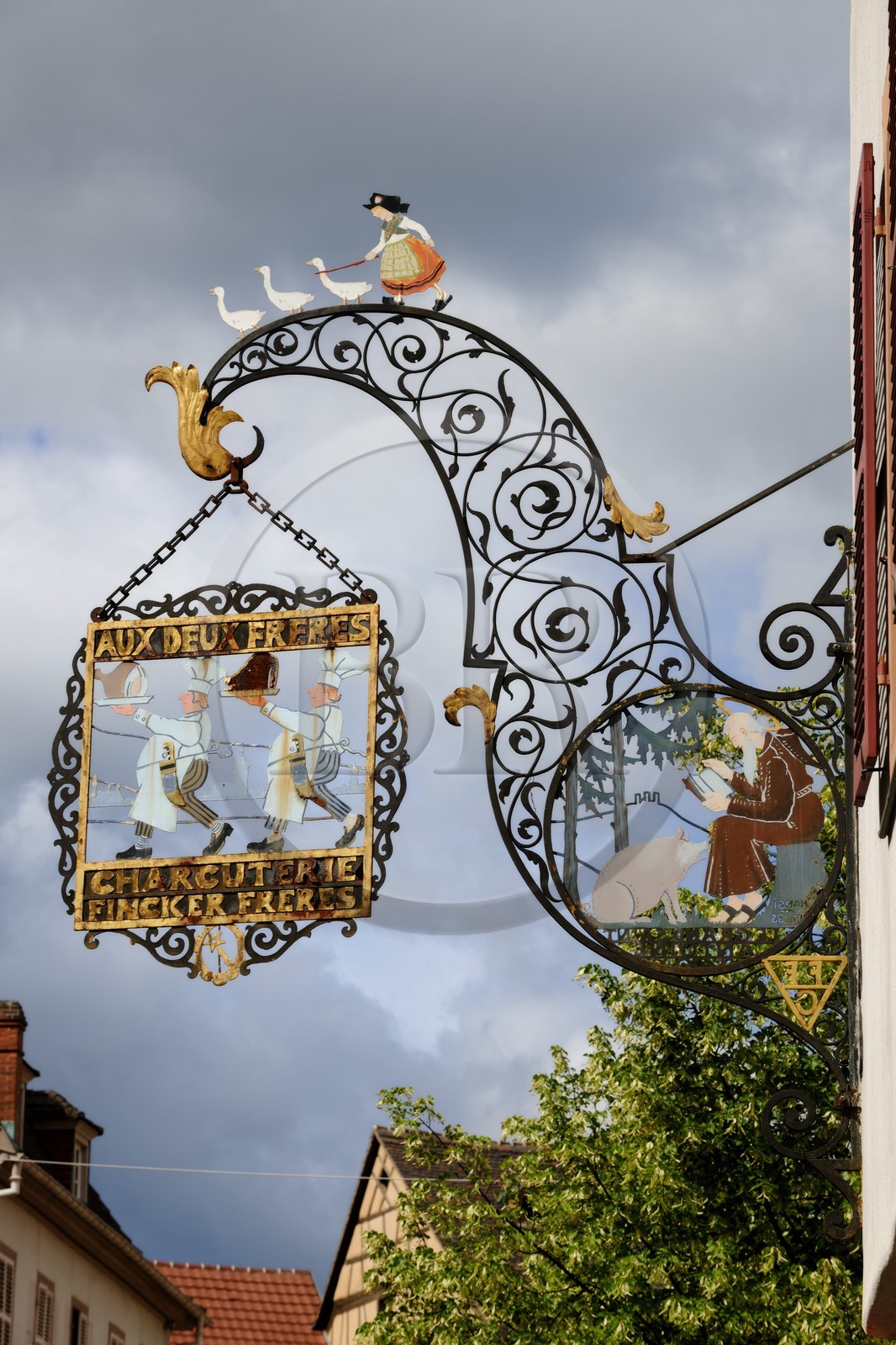 France, Haut Rhin, Colmar, sign of the charcuterie or butcher shop called Finker « Aux deux frères » created by Hansi in the rue des Tetes