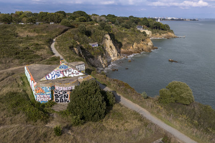 France, Loire Atlantique, Estuaire de la Loire, Saint Nazaire, Pointe de l'Eve, old bunker batteries with gabled roofs transformed by the Germans to evoke the silhouettes of houses from afar (aerial view)