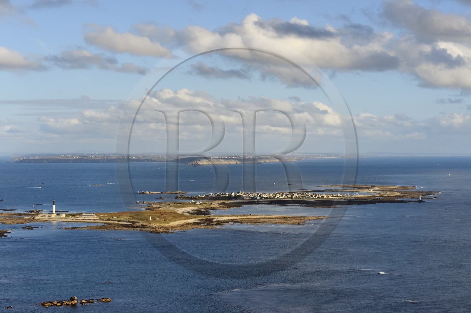 France, Finistere, Iroise Sea, Parc Naturel Regional d'Armorique (Natural Regional Park of Armorique), Ile de Sein, labelled Les Plus Beaux Villages de France (The Most Beautiful Villages of France) and Pointe du Raz in the background (aerial view)