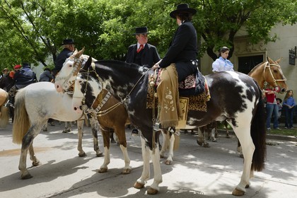 Argentina, Buenos Aires Province, San Antonio de Areco, Tradition Day festival (Dia de Tradicion), gauchos parade on horseback in traditional dress,  estanciero (gaucho who owns a ranch)