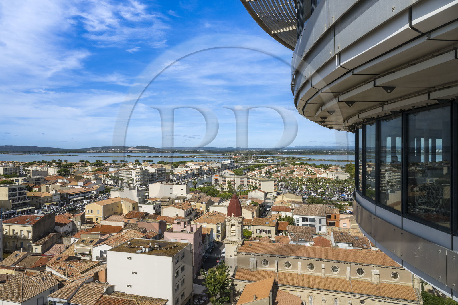 France, Herault, Palavas-Les-Flots, the city seen from the Phare de la Méditerranée (Lighthouse of the Mediterranean), observation tower of 43 meters resulting from the transformation of the old water tower, the Mejean pond in the background