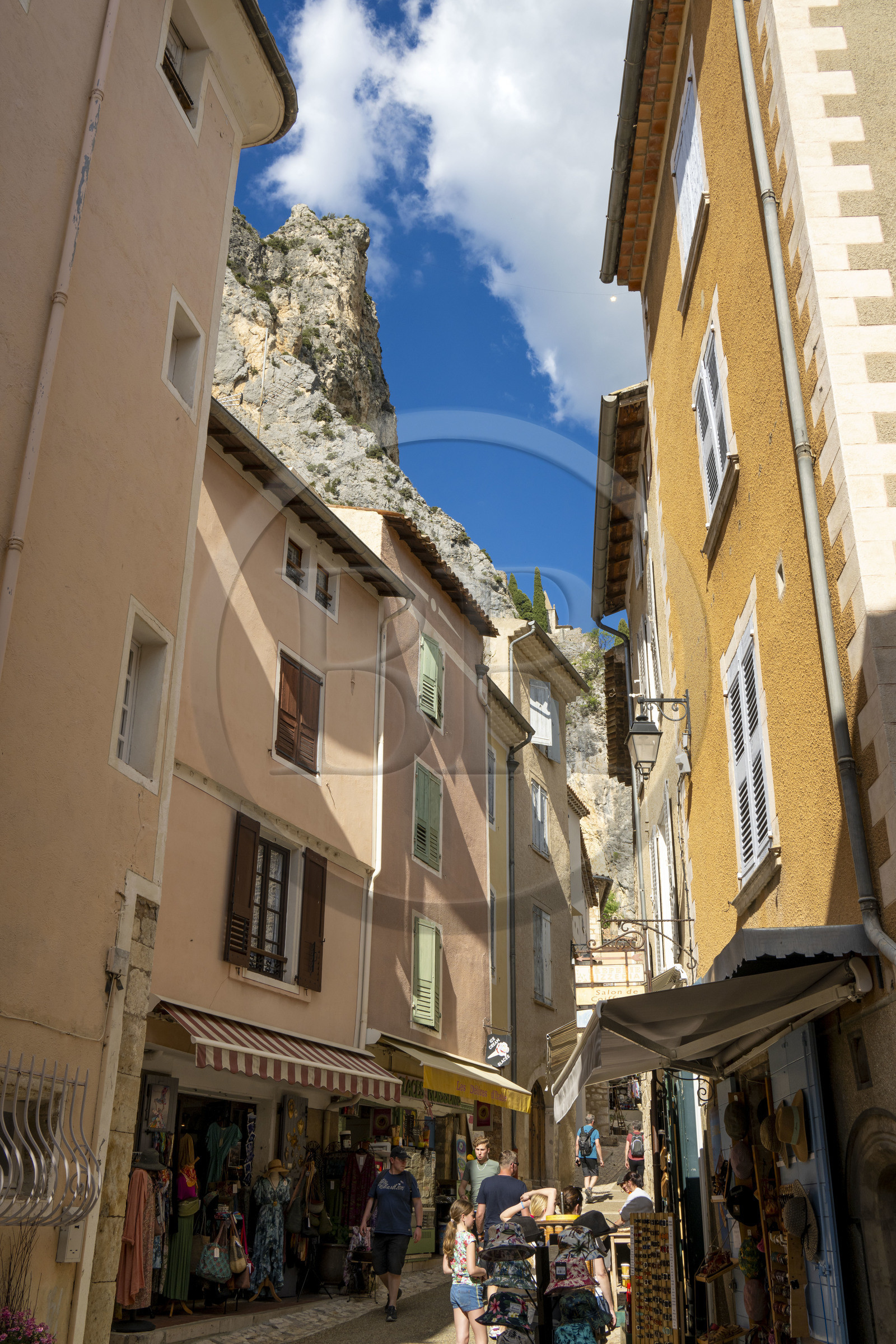 France, Alpes de Haute Provence, Parc Naturel Régional du Verdon, village of Moustiers Sainte Marie, labelled Les Plus Beaux Villages de France (The Most Beautiful Villages of France), and the Notre-Dame de Beauvoir chapel in the background in the cliff