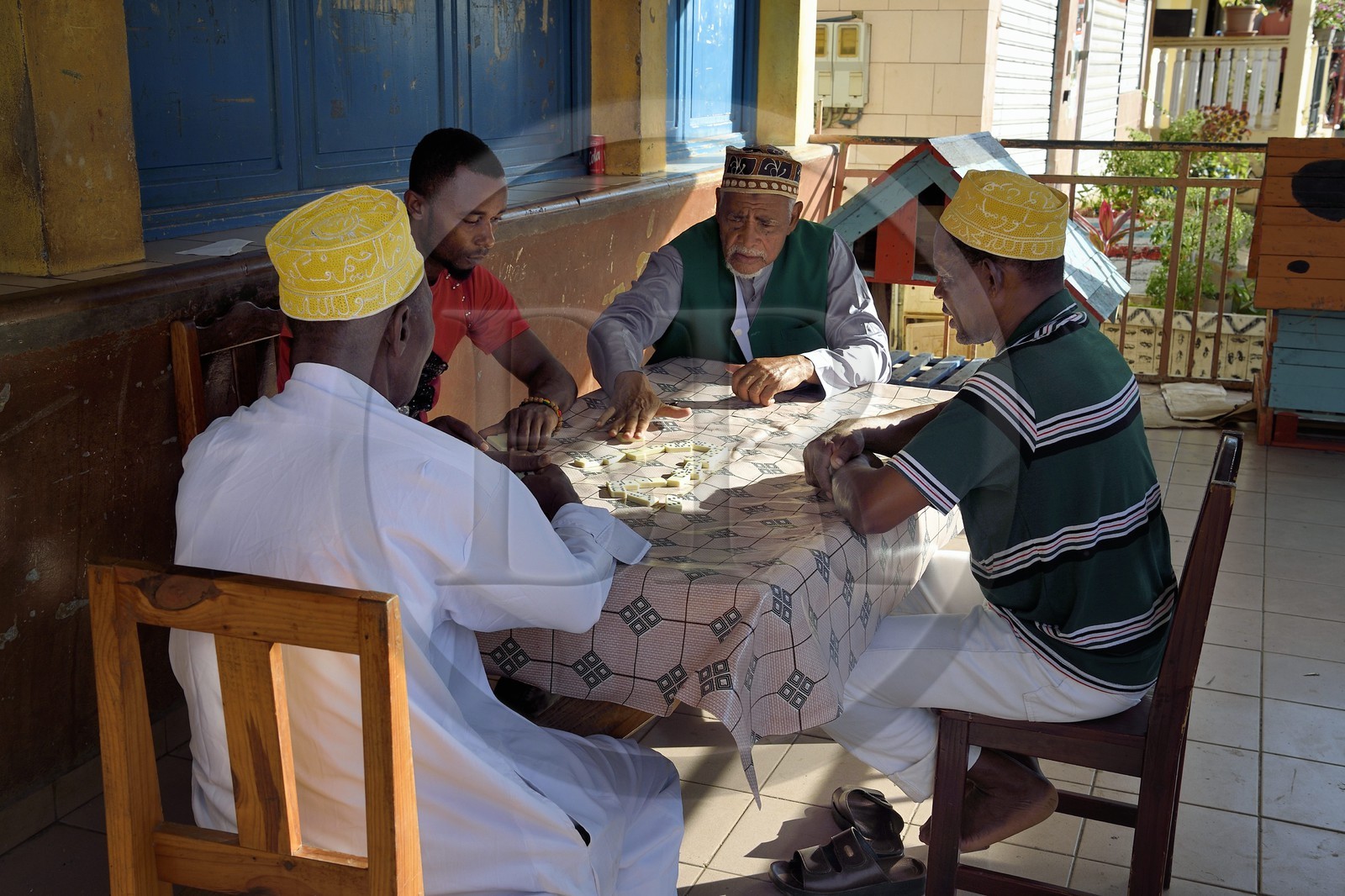 France, Mayotte island (French overseas department), Grande-Terre, Sada, domino players wearing an embroidered kofia, traditional Comoran hat