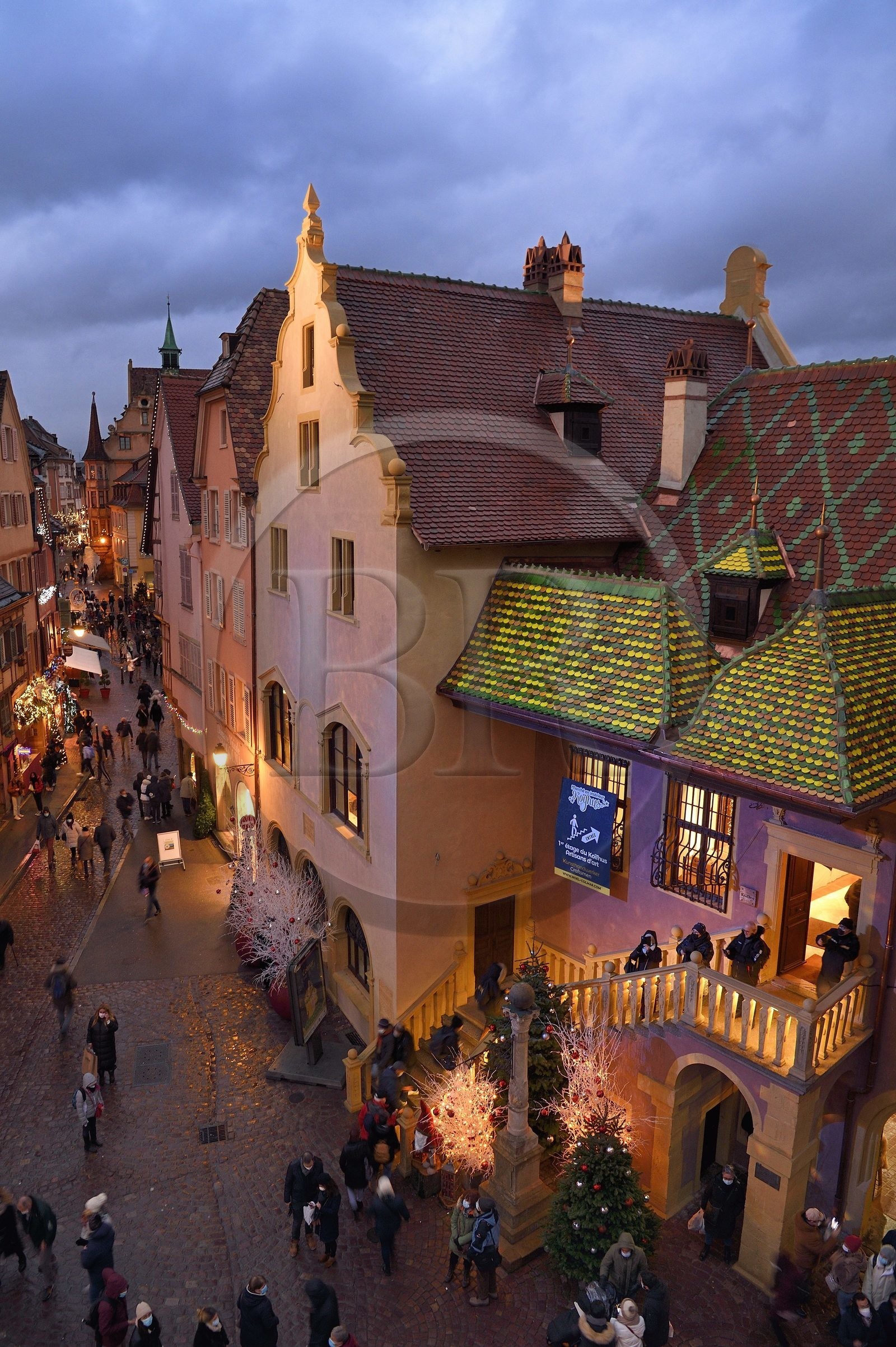 France, Haut Rhin, Colmar, gabled houses and wood-framed houses in Grand Rue with Christmas decorations, on the right the former douane or customs control edifice (Koifhus)