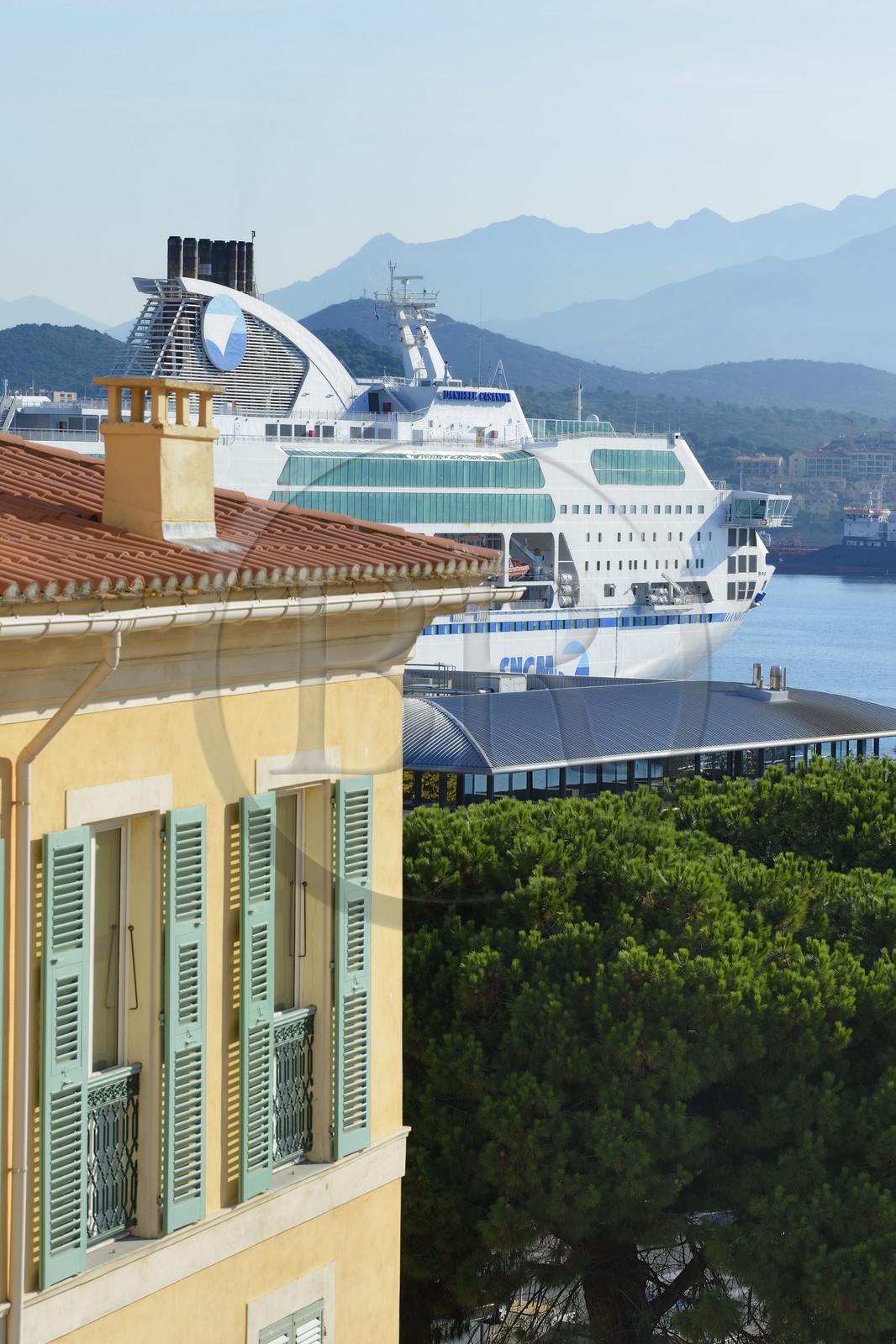 France, Corse du Sud, Ajaccio, building in the city center and ferry boat at dock