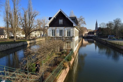 France, Bas Rhin, Strasbourg, old town listed as World Heritage by UNESCO, la Petite France District, corner Ponts Couverts and quai du Woerthel along one of the branches of the Ill river and the Cathedral in the background