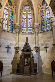 Spain, Catalonia, Barcelona, Eixample district, Sagrada Familia basilica by Catalan modernist architect Antoni Gaudi, listed as a UNESCO World Heritage Site, the neo-Gothic style crypt serves as a parish church, furniture and liturgical objects designed by Gaudi, priest Joby Sebastian Kappiparambil in the confessional