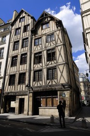 France, Paris, the oldest houses of Paris at 11 and 13 Rue Francois Miron, house with the sheep sign and reaper sign (14th century)