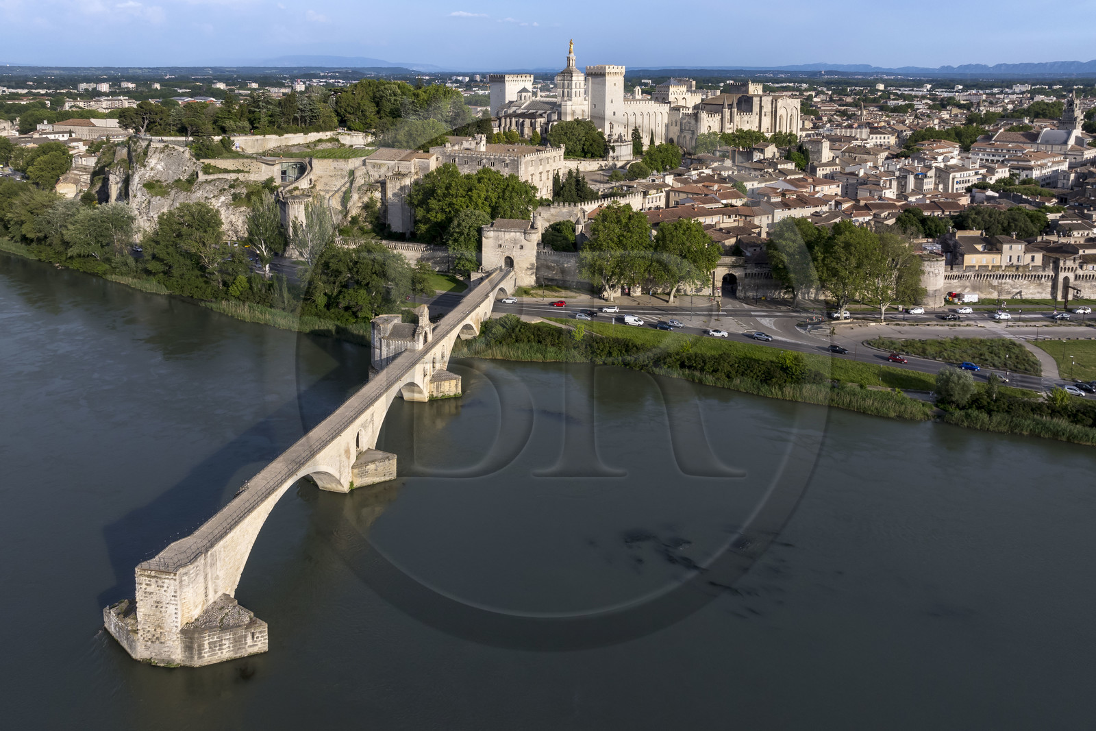 France, Vaucluse, Avignon, the Saint-Bénézet bridge (Pont d'Avignon) on the Rhone river and the Palais des Papes (Palace of the Popes), listed as World heritage by UNESCO, in the background (aerial view)