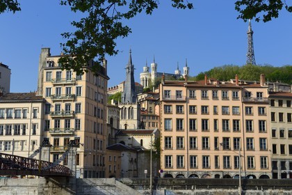 France, Rhone, Lyon, historical site listed as World Heritage by UNESCO, Quai Bondy and the Saint Vincent Footbridge over the Saone River, Saint Paul church, Notre Dame de Fourviere Basilica and the Metal Tower in the background