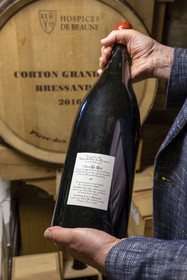 France, Cote d'Or, Climats terroirs of Burgundy, listed as World Heritage by UNESCO, Beaune, Hotel Le Cep in the 15th and 16th century Brunet de Monthelie mansion, wine cellar, barrel of Corton Grand Cru Bressandes 2016 la Pièce des Présidents purchased at the Hospices de Beaune auction