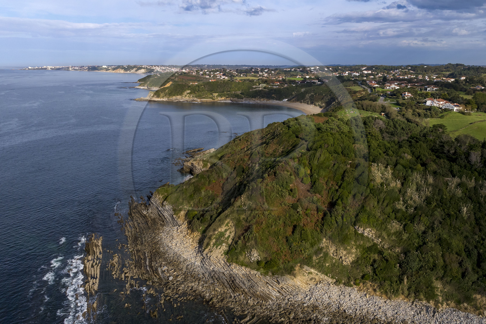 France, Pyrenees Atlantiques, Basque Country coast, Saint-Jean-de-Luz, coastal path on the GR 8, flysch cliffs at the cape overlooking Erromardie beach and the coast between Guéthary and Biarritz in the background (aerial view)