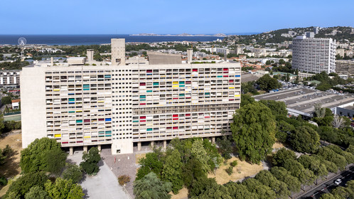 France, Bouches du Rhone, Marseille, architectural work of Le Corbusier, listed as World heritage by UNESCO, the Cité Radieuse by the architect Le Corbusier and the Le Brasilia building designed by the architect Fernand Boukobza under the influence of Le Corbusier in the background (aerial view)