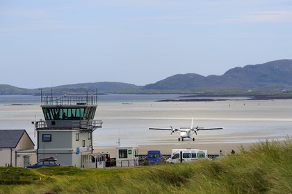 United Kingdom, Scotland, Outer Hebrides, Isle of Barra, Twin Otter landing at Barra Airport, the runway is the beach at low tide