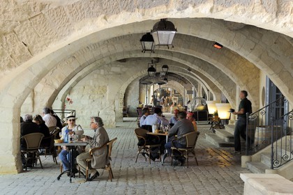 France, Gard, Uzes, listed as town of art and history, restaurant under the arcades surrounding the Place aux Herbes