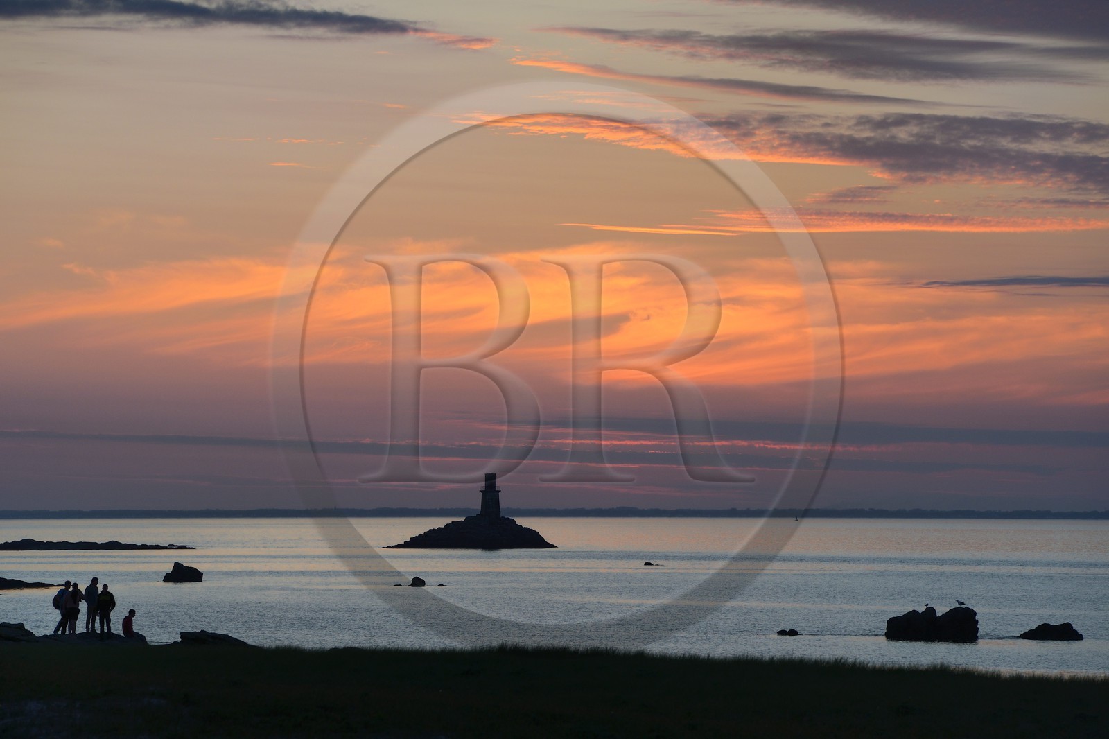 France, Finistere, La Foret Fouesnant, Glenan islands, St Nicolas Island, sunset on the west coast and the former Huic lighthouse now abandoned