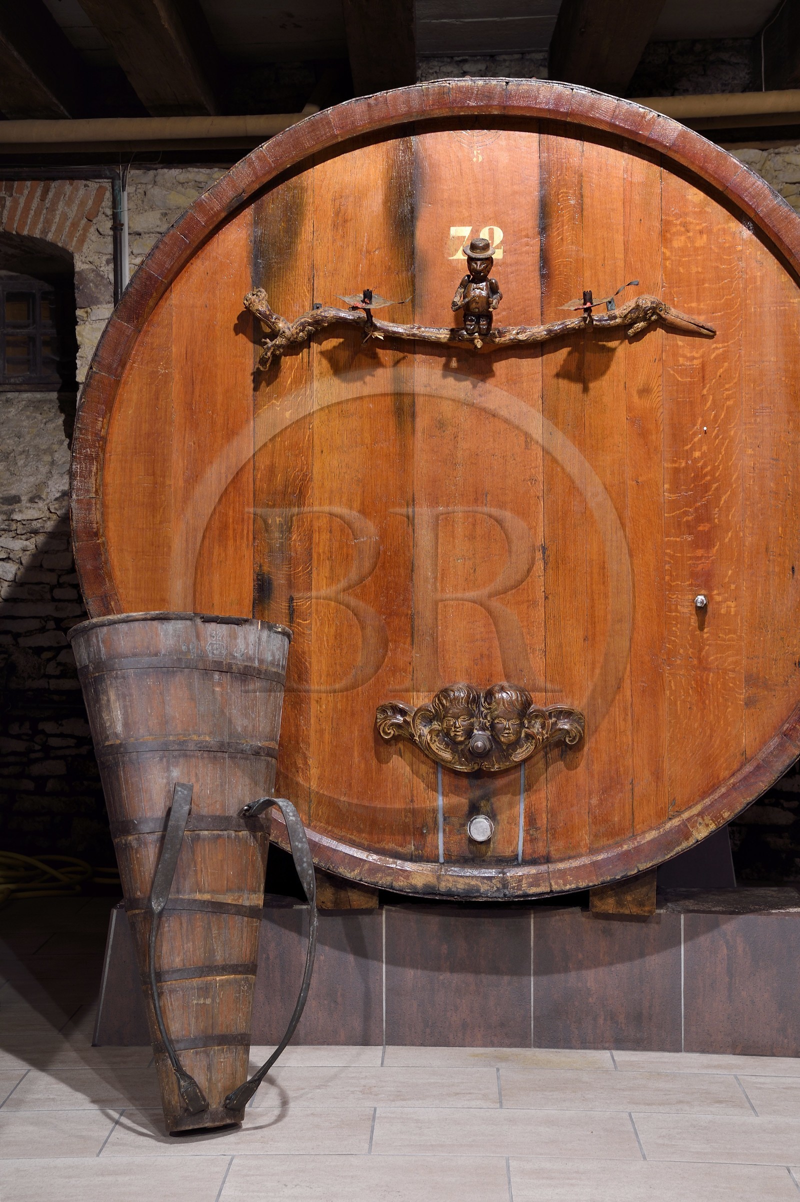 France, Bas Rhin, the Alsace Wine Route, Mittelbergheim, labelized the Most Beautiful Villages of France, 16th century underground cellars of the Wine estate GILG, centenary large barrel